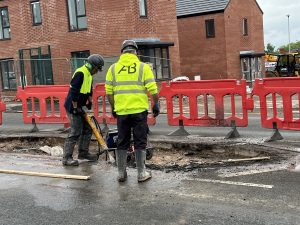 Blog 14 Ashley Browitt and Scott Browitt working on road